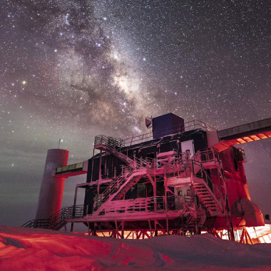 photo of research facility with the milky way galaxy in the background